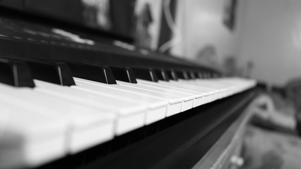 Classic black and white close-up of piano keys capturing the essence of musical harmony.